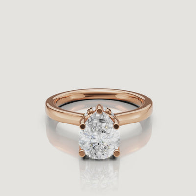 video of pear cut lab grown diamond solitaire engagement ring in 14k rose gold