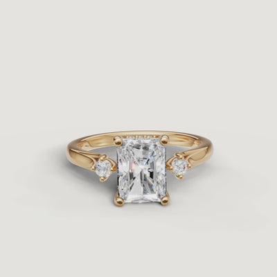 14K yellow gold radiant cut lab grown diamond engagement ring with round side stones by Raul Diamonds