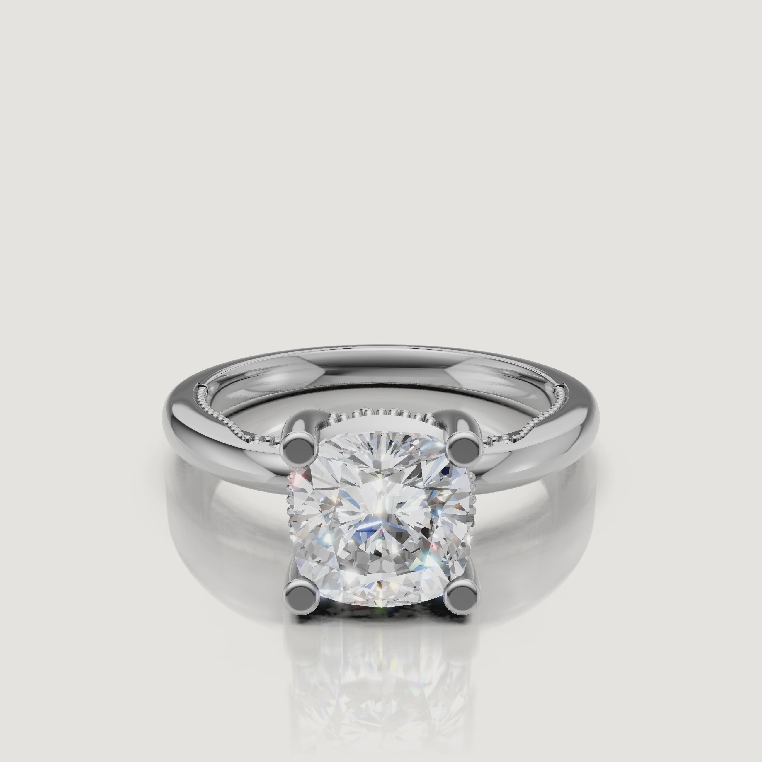 Macro video showcase of a white gold cushion cut solitaire ring by Raul Diamonds, displaying the crisp geometric edges and high-polish finish.