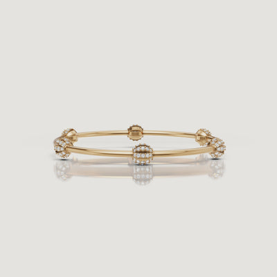 Yellow gold floral diamond bangle bracelet video by Raul Diamonds with sparkling cluster design