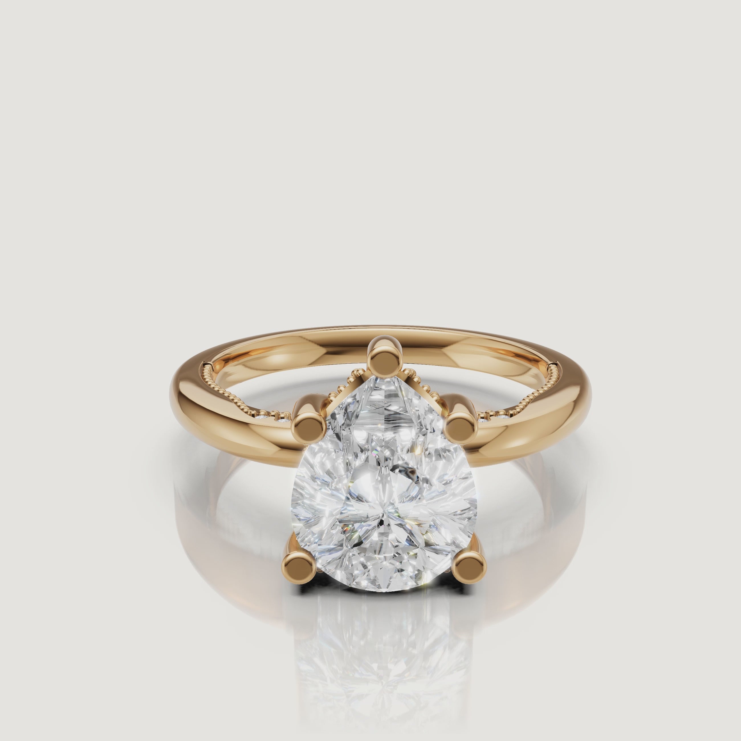 Cinematic 4K video of a Raul Diamonds pear-cut ring in yellow gold, showing the teardrop symmetry and the warm glow of the 18k gold band