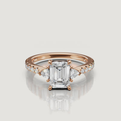 Cinematic close-up video of a Rual Diamonds three-stone emerald cut diamond ring, demonstrating the light performance and 'hall of mirrors' effect of the center stone