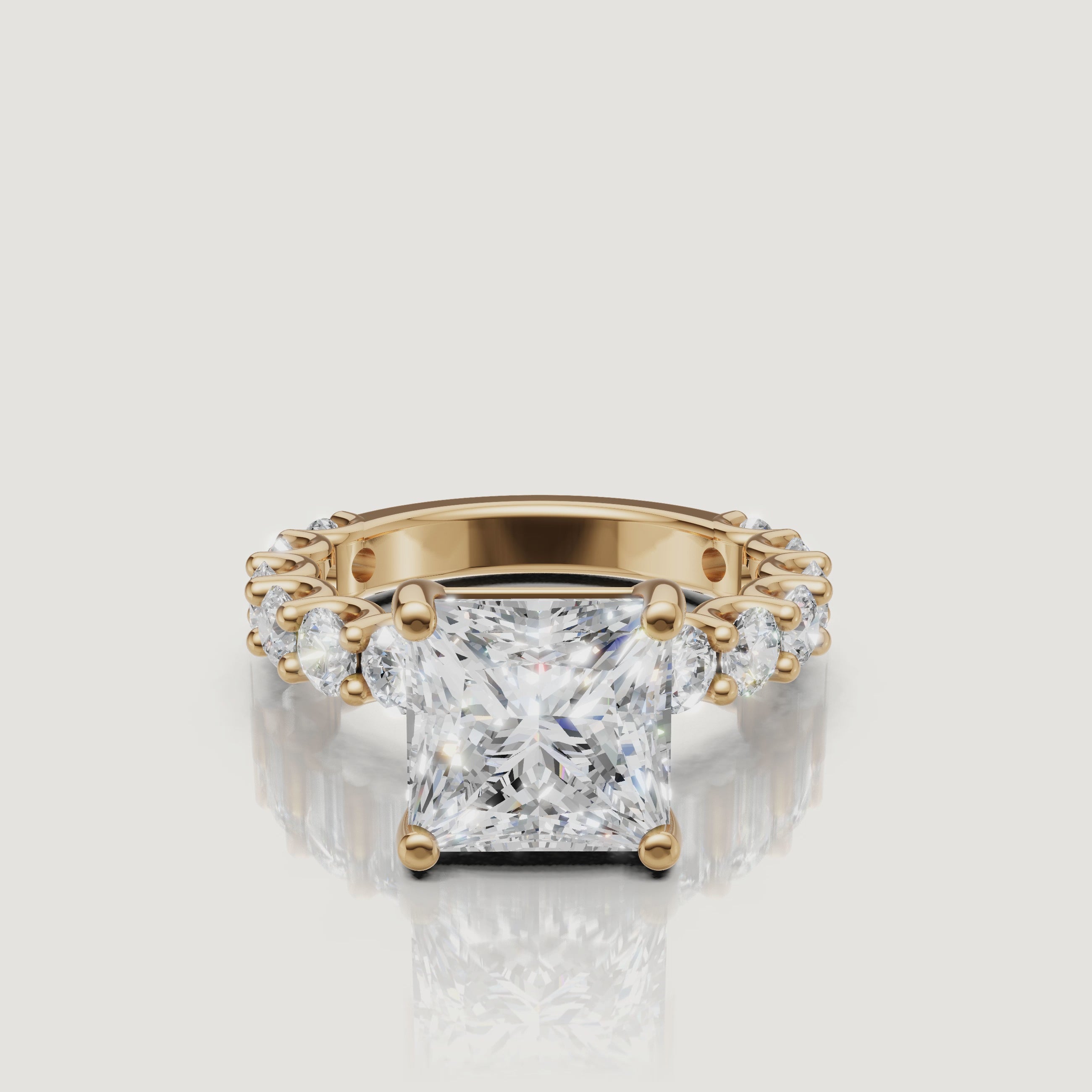 Product video of a Raul Diamonds princess-cut diamond ring in 18k yellow gold, showcasing the sharp brilliance of the square cut and full eternity band