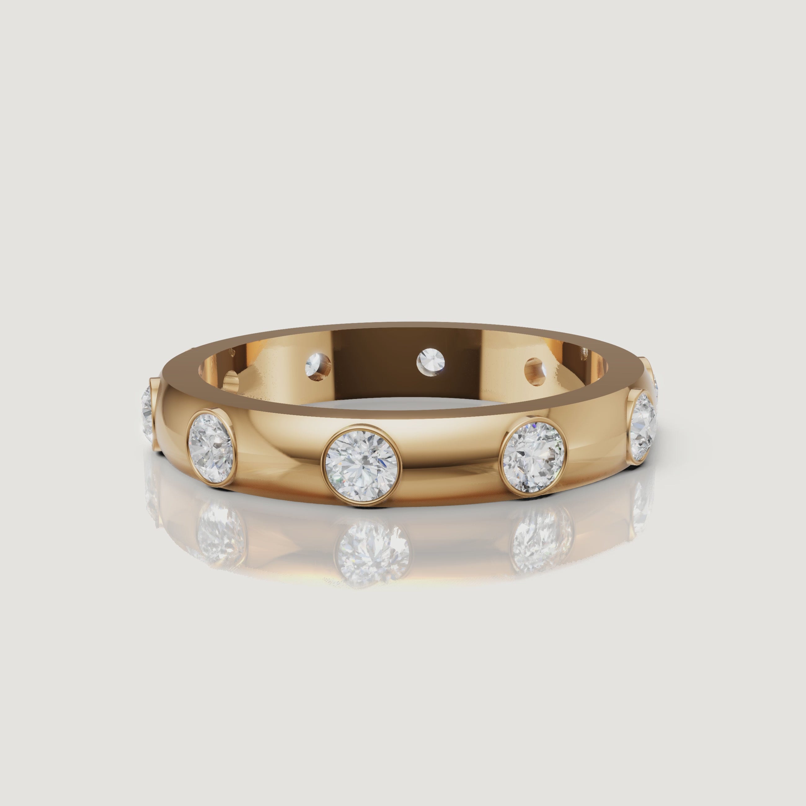 rotating view of bezel set round lab grown diamond eternity band in polished gold