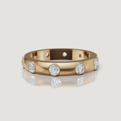 rotating view of bezel set round lab grown diamond eternity band in polished gold