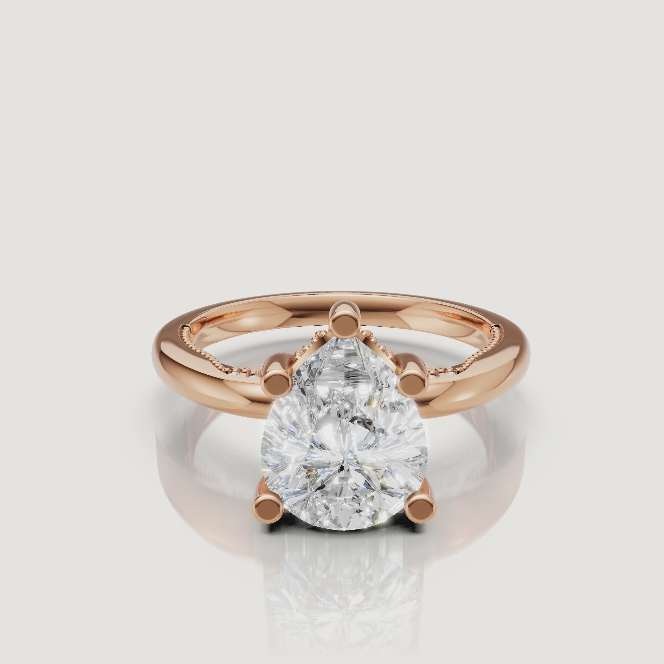 Close-up video of a rose gold pear-shaped diamond ring by Raul Diamonds, capturing the romantic blush tones and the 'crushed ice' sparkle of the facets.