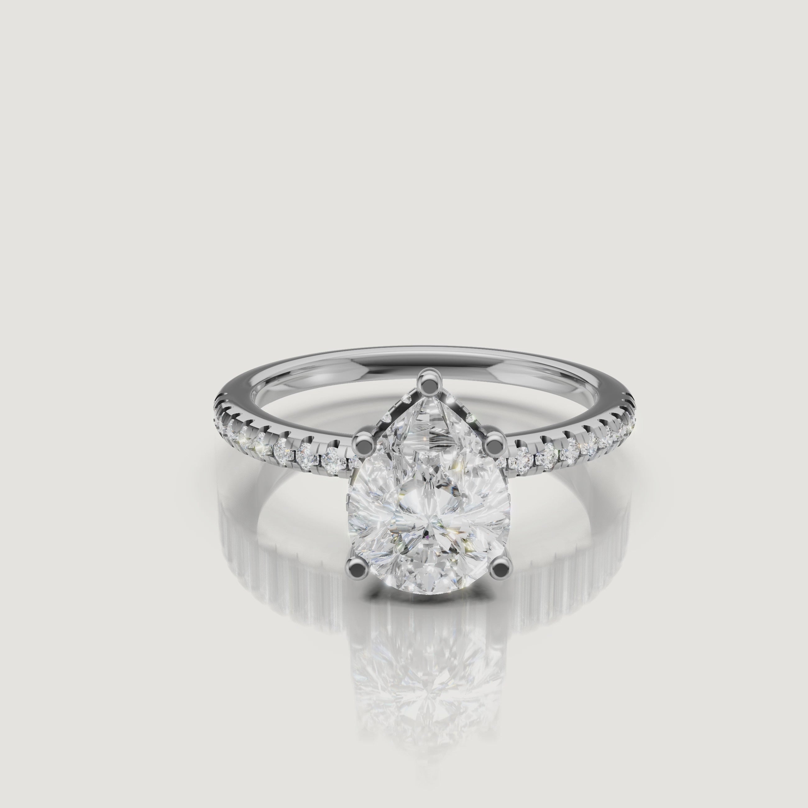 cinematic showcase of teardrop lab grown diamond engagement ring with micro pavé setting