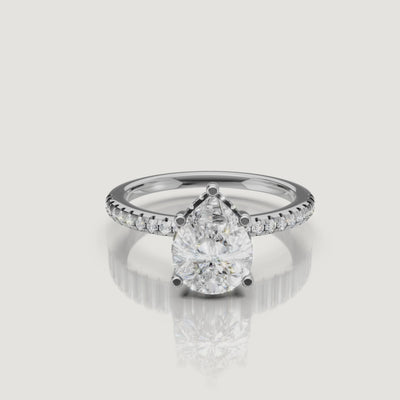 cinematic showcase of teardrop lab grown diamond engagement ring with micro pavé setting