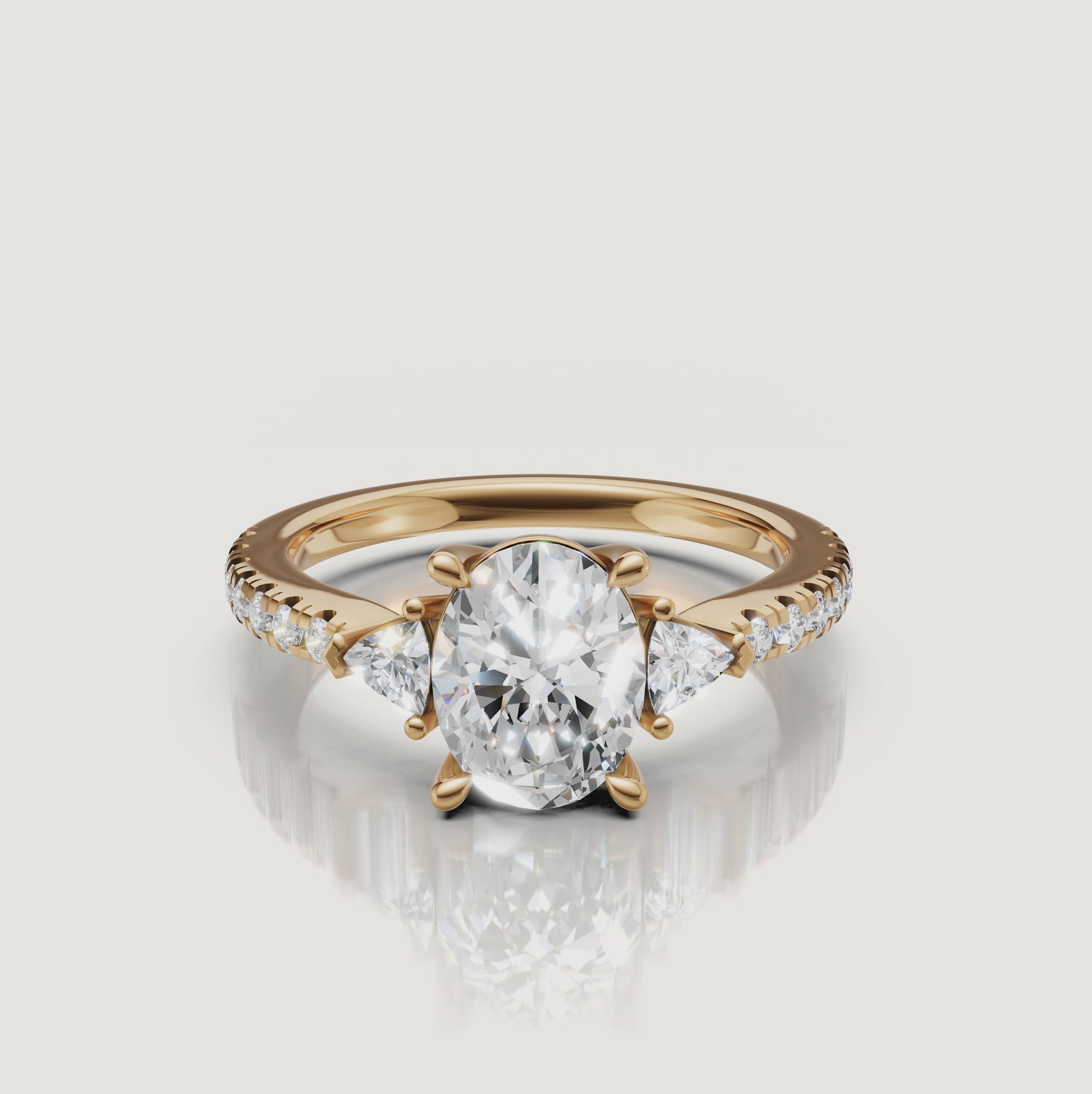 A 360-degree video showcase of a Rual Diamonds oval-cut three-stone ring, highlighting the brilliant center stone and trillion-cut diamond accents