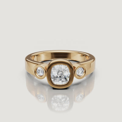 360 video of the Seo yellow gold bezel diamond engagement ring with side stones by Raul Diamonds.