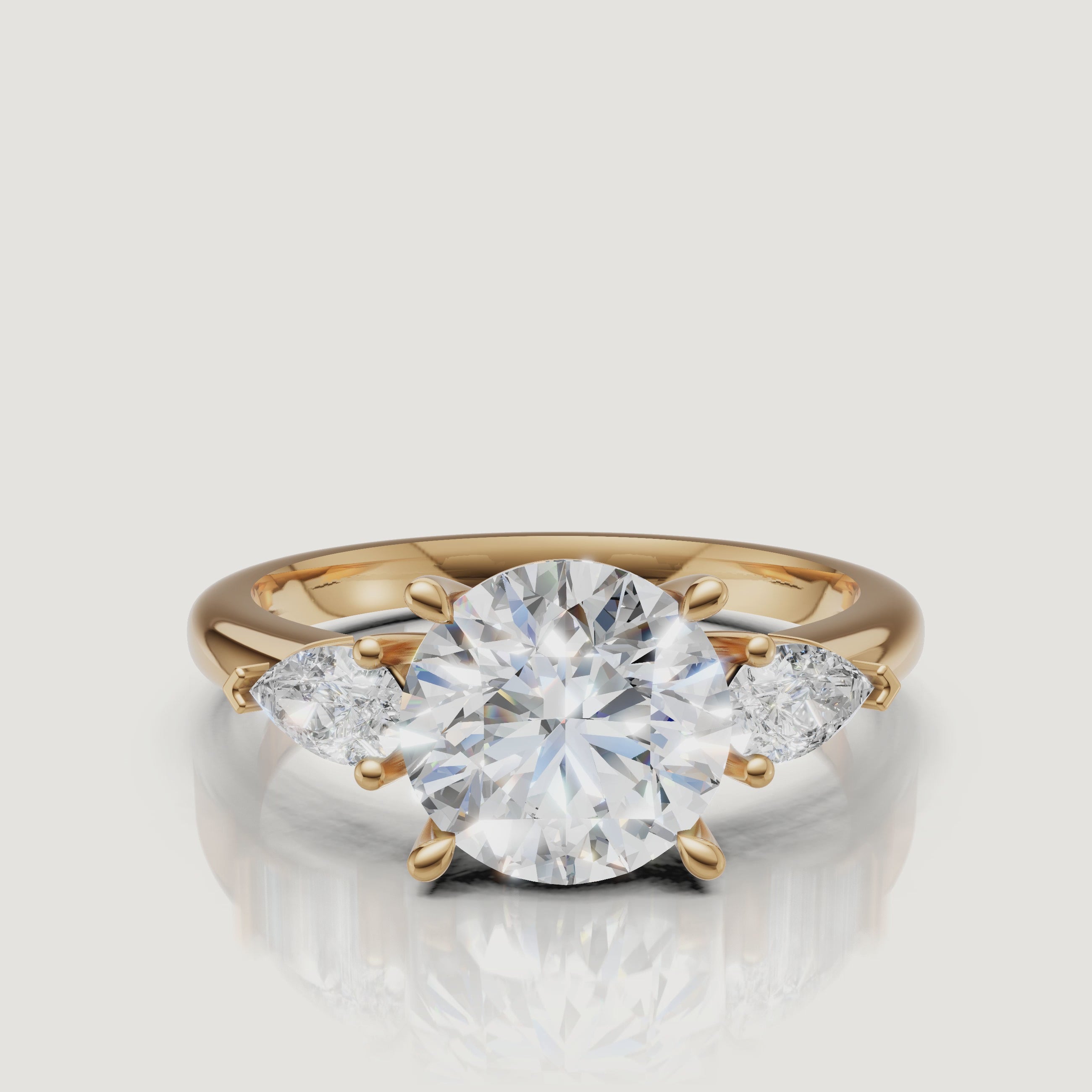 video of round cut lab grown diamond engagement ring with marquise side stones in 14k yellow gold