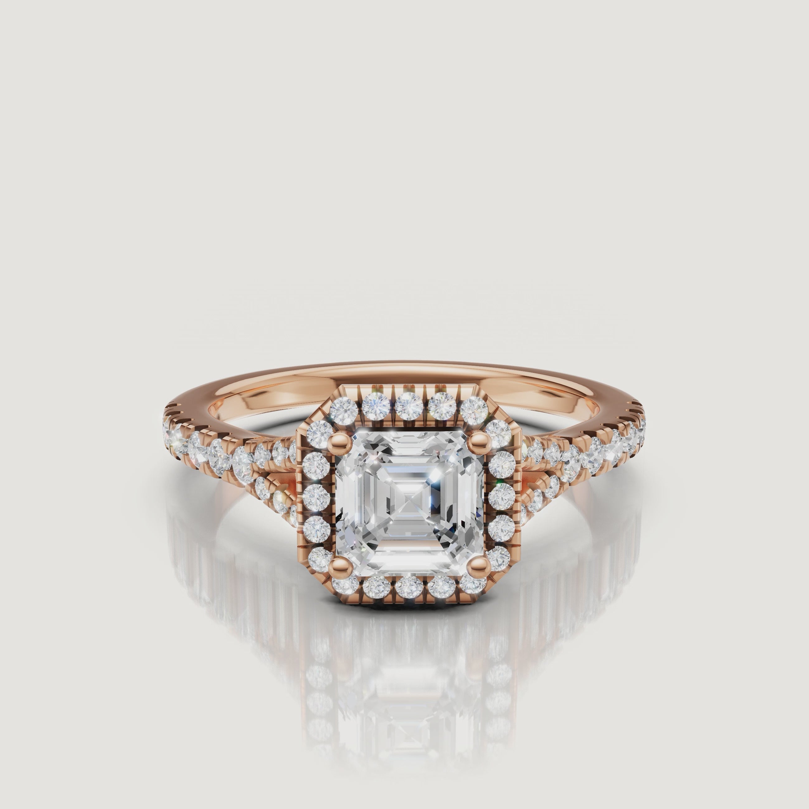 Close-up video of a sparkling Asscher cut diamond halo ring in elegant rose gold by Raul Diamonds, highlighting the vintage-inspired silhouette.