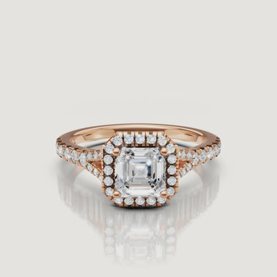 Close-up video of a sparkling Asscher cut diamond halo ring in elegant rose gold by Raul Diamonds, highlighting the vintage-inspired silhouette.