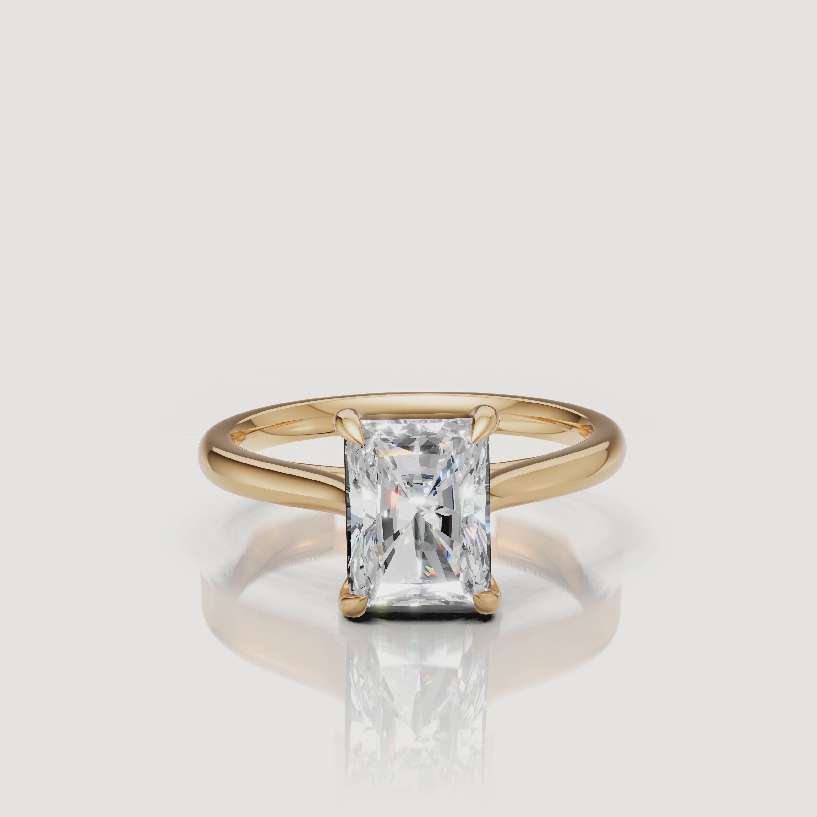 Rotating video of Raul Diamonds radiant cut yellow gold solitaire engagement ring with polished band