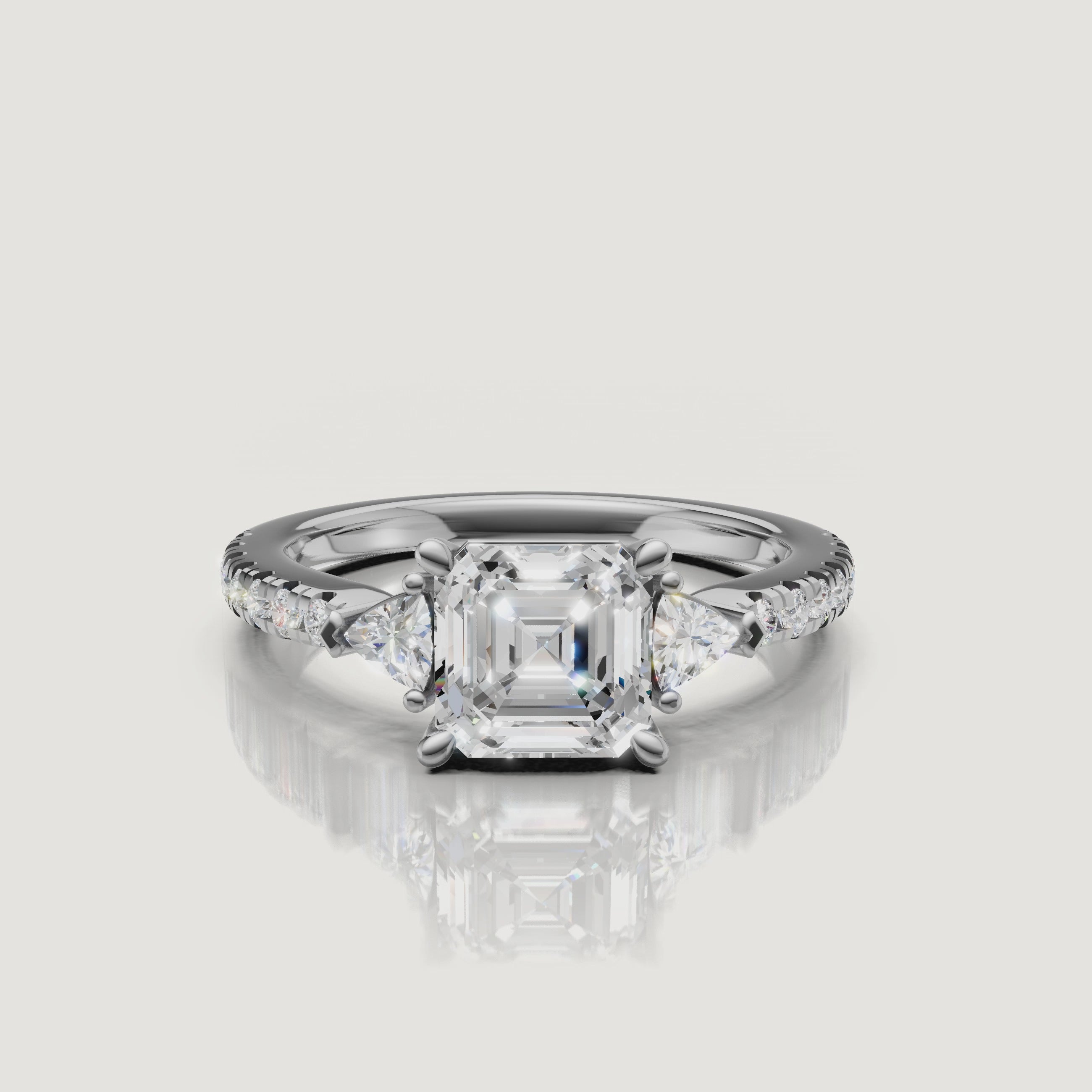 Lifestyle video of a model wearing an asscher cut diamond ring from Rual Diamonds, demonstrating how the unique three-stone design looks in motion