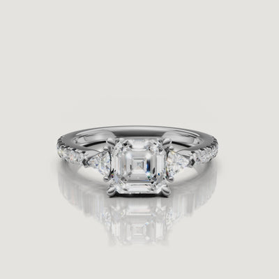 Lifestyle video of a model wearing an asscher cut diamond ring from Rual Diamonds, demonstrating how the unique three-stone design looks in motion