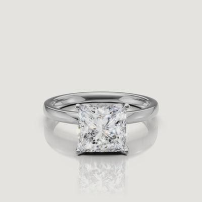 Cinematic video of a white gold princess cut solitaire engagement ring from Raul Diamonds, demonstrating the crisp lines and brilliant-cut facets of the square center stone