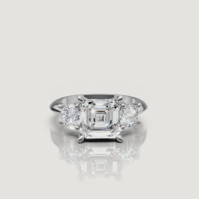 High-definition video of the Raul Diamonds white gold Asscher three-stone engagement ring, demonstrating the brilliant architectural geometric flow of the trilogy setting