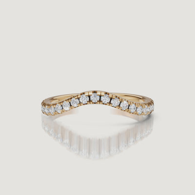 Yellow gold curved diamond wedding band video by Raul Diamonds with pavé diamond sparkle