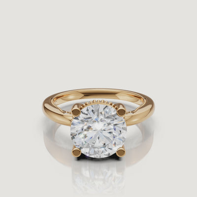 Cinematic 4K video of a Raul Diamonds round brilliant ring in yellow gold, demonstrating the high-intensity light return and warm 18k gold glow