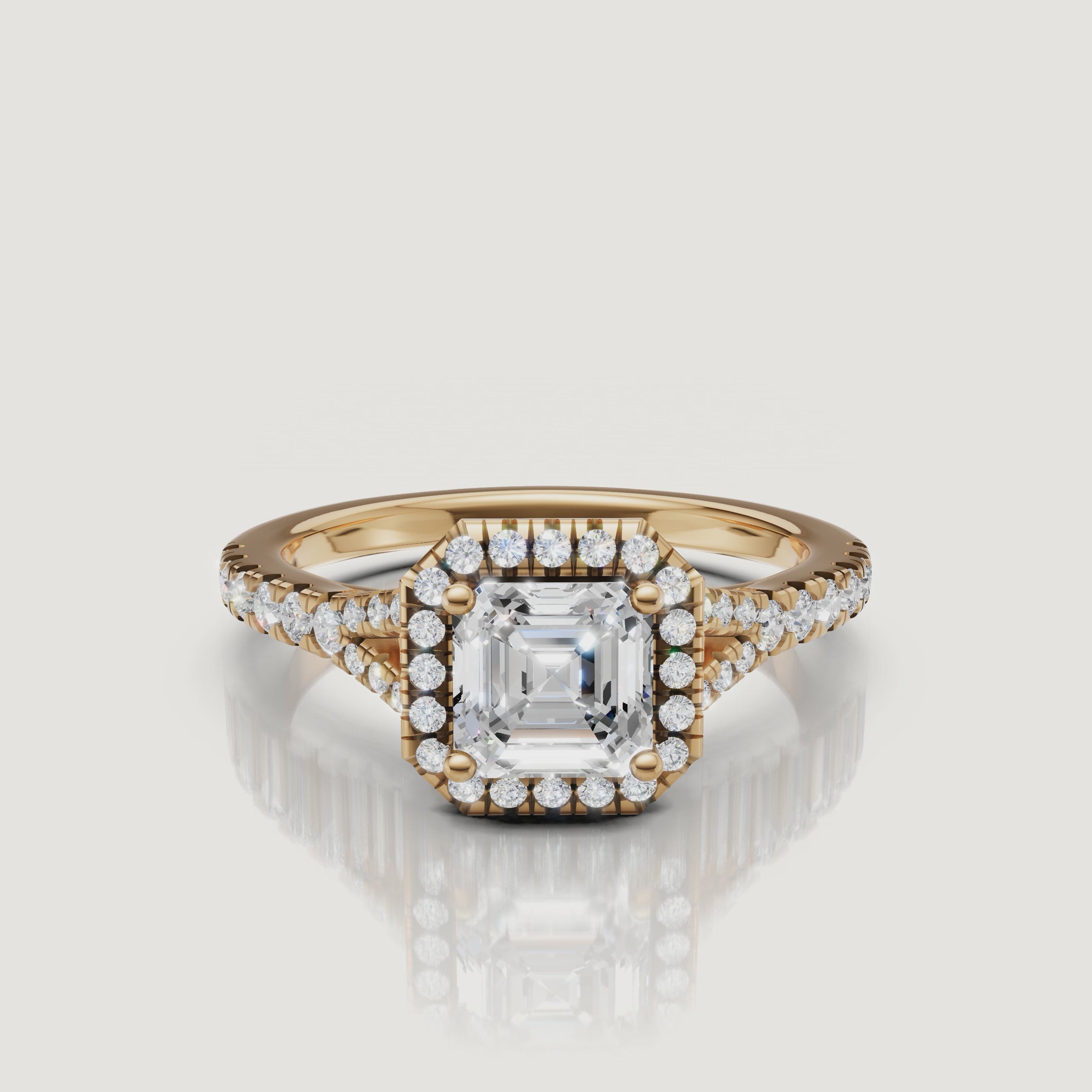 360-degree video showcase of a Raul Diamonds Asscher cut engagement ring in 18k yellow gold, featuring a brilliant diamond halo and split shank design.