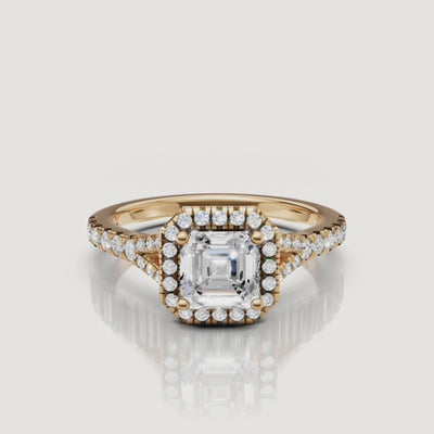 360-degree video showcase of a Raul Diamonds Asscher cut engagement ring in 18k yellow gold, featuring a brilliant diamond halo and split shank design.