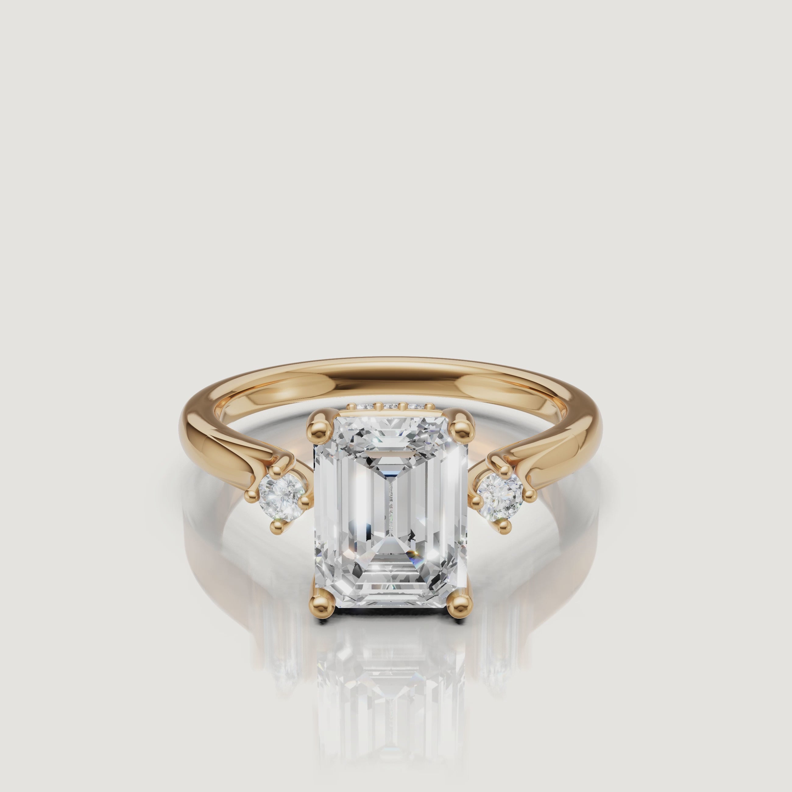 14K yellow gold emerald cut lab grown diamond engagement ring with round side stones by Raul Diamonds