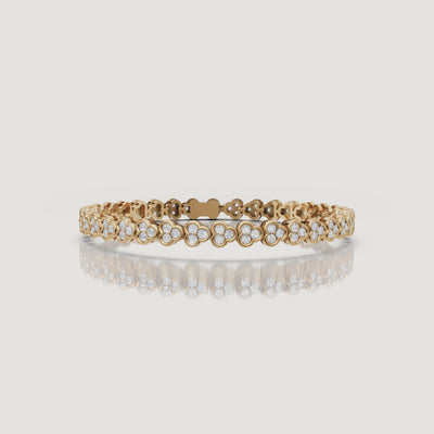 Luxury yellow gold floral diamond bracelet video by Raul Diamonds featuring sparkling lab grown diamonds in a clover-inspired design, elegant wrist movement, cinematic macro close-ups, warm luxury lighting, and premium fine jewelry styling for a timeless sophisticated look
