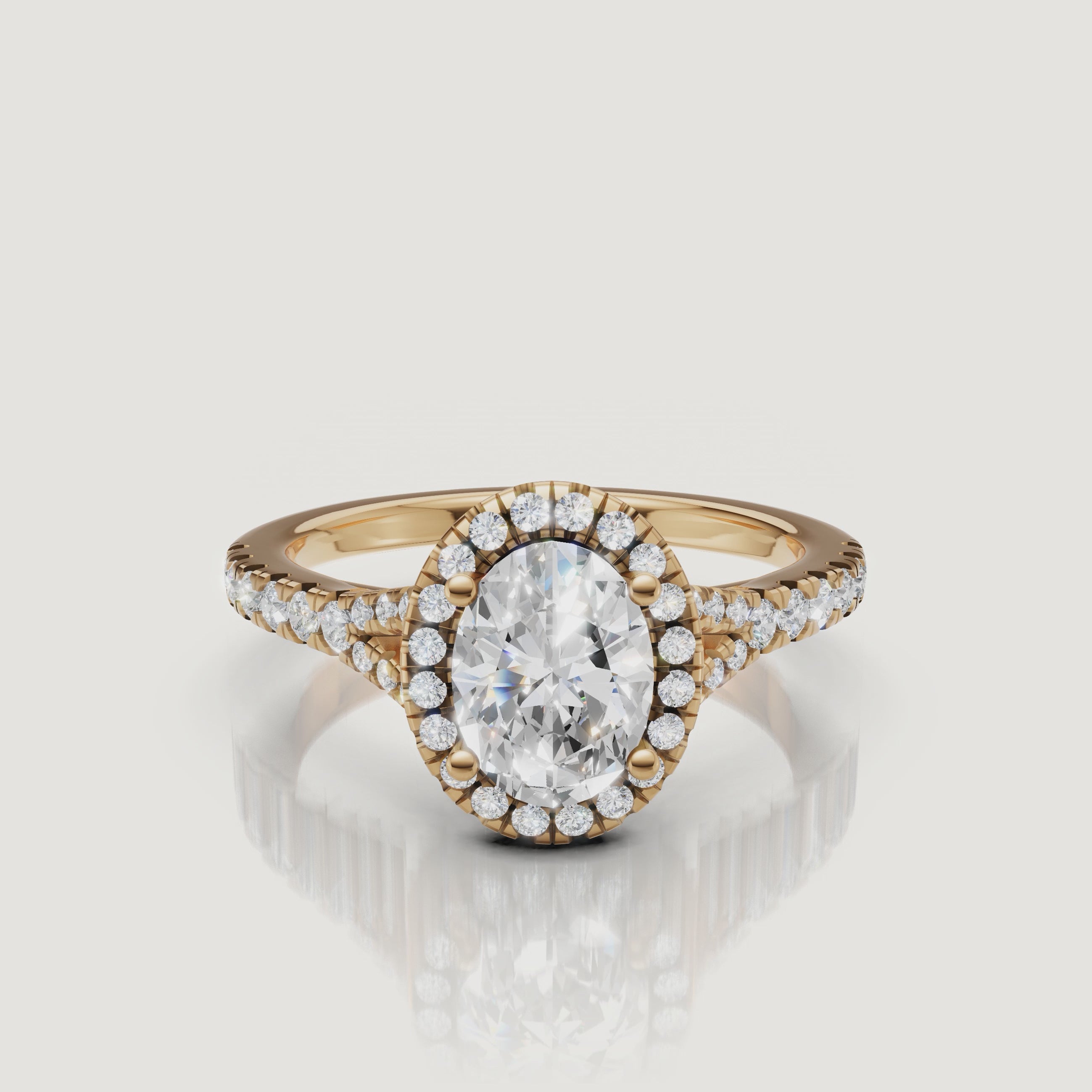 A stunning 360-degree video of a Raul Diamonds oval cut engagement ring in yellow gold, highlighting the shimmering halo and split shank detail