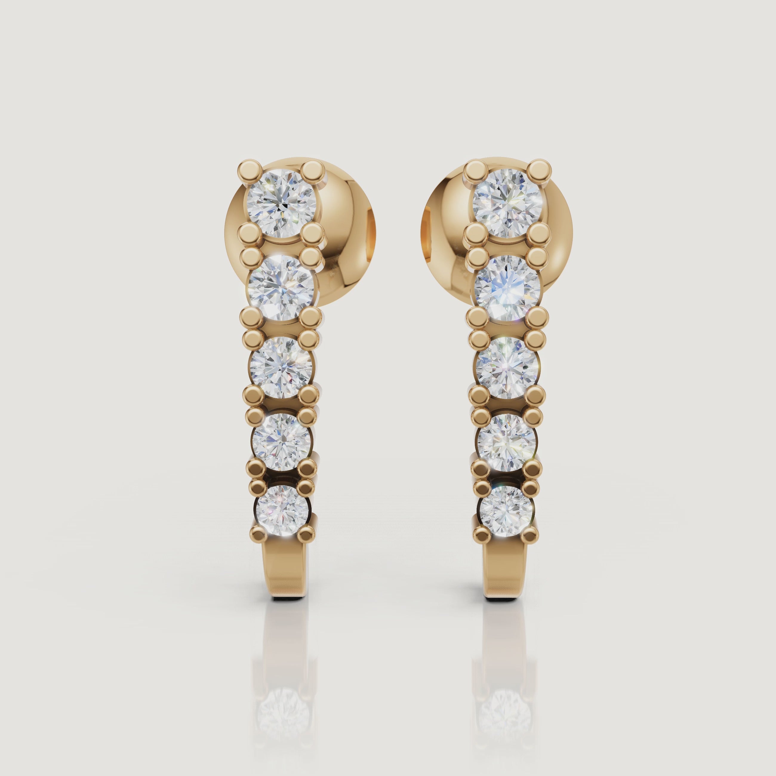 Yellow gold diamond huggie hoop earrings sparkle video by Raul Diamonds