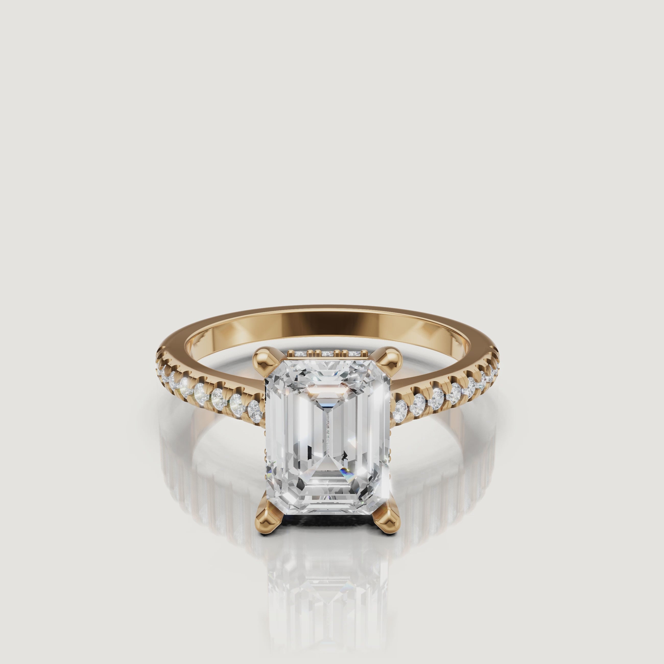 360 view of emerald cut lab grown diamond pavé engagement ring in 14K yellow gold by Raul Diamonds