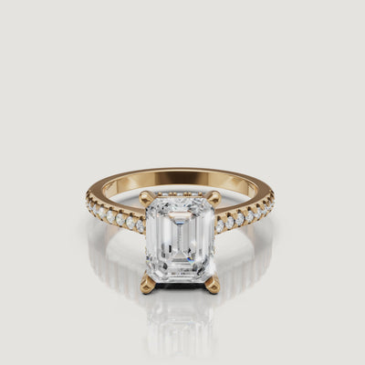 360 view of emerald cut lab grown diamond pavé engagement ring in 14K yellow gold by Raul Diamonds