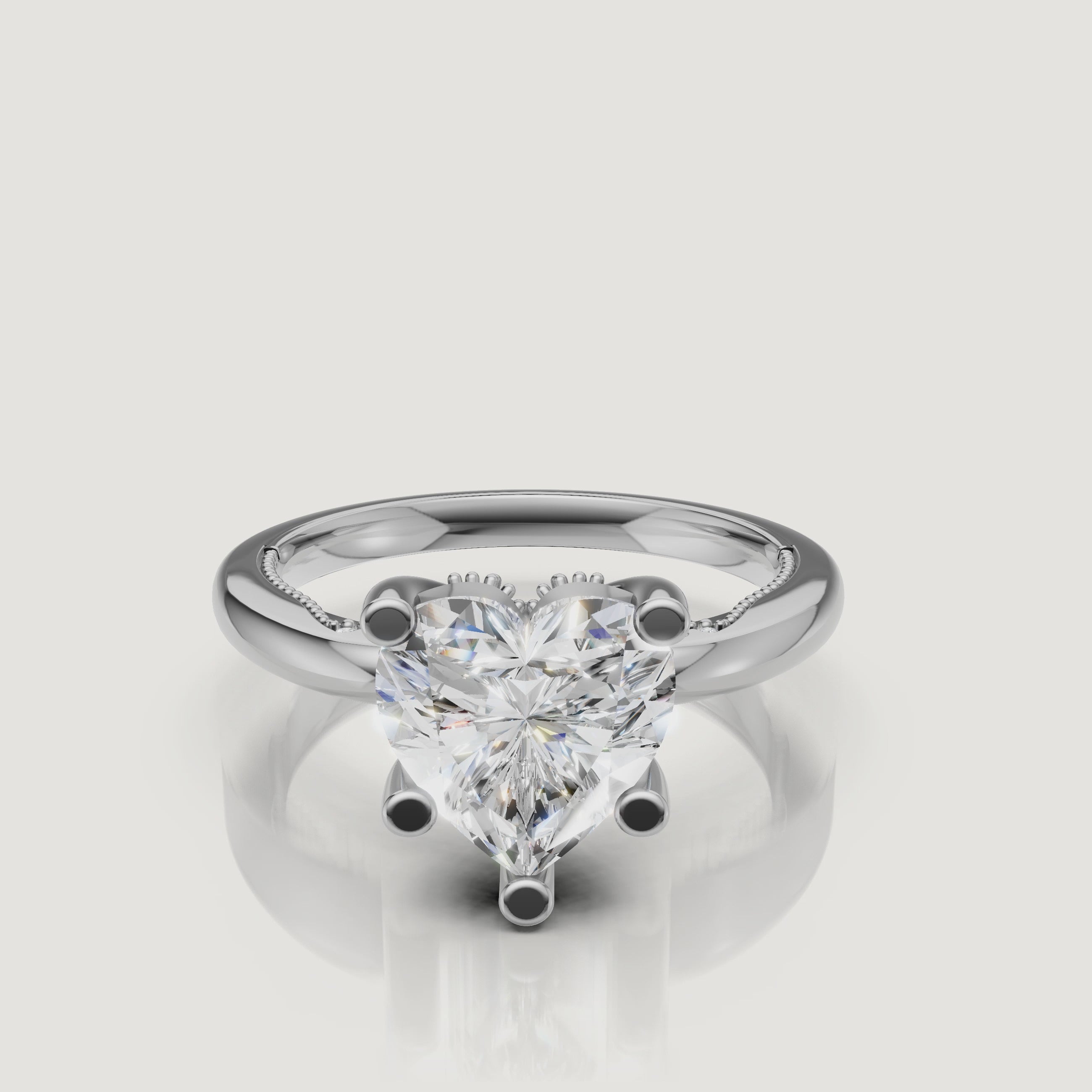 Macro video showcase of a Raul Diamonds white gold heart solitaire ring, displaying the crisp facets and brilliant white light performance