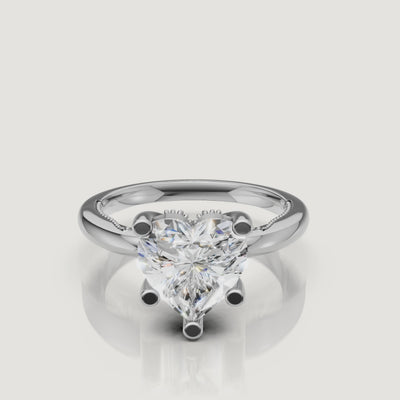 Macro video showcase of a Raul Diamonds white gold heart solitaire ring, displaying the crisp facets and brilliant white light performance
