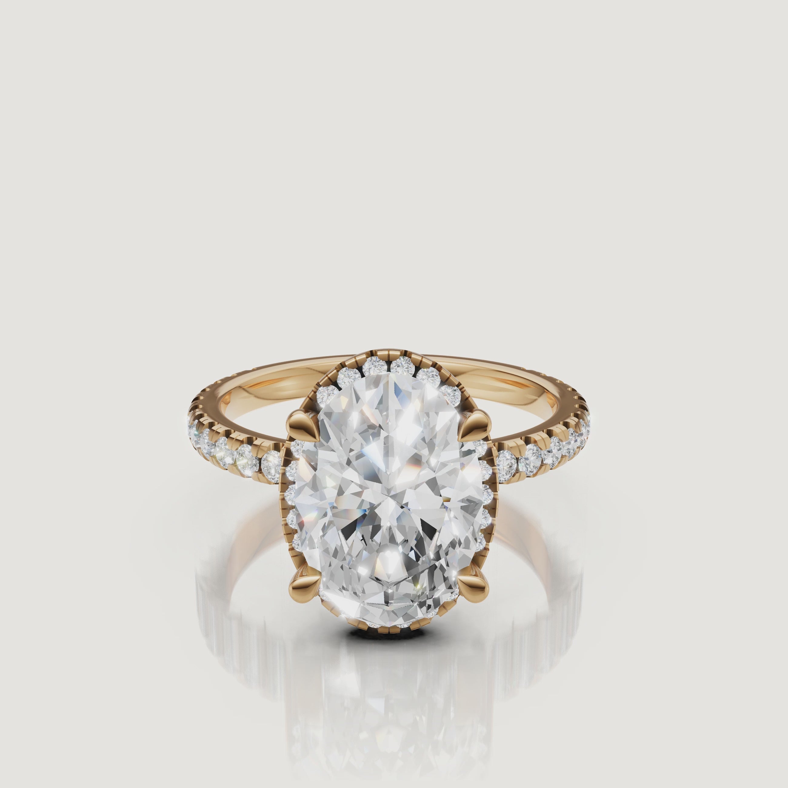 Cinematic 4K video of a Raul Diamonds Oval Cut Hidden Halo ring in 18k yellow gold, featuring a 360-degree view of the pavé diamond shank