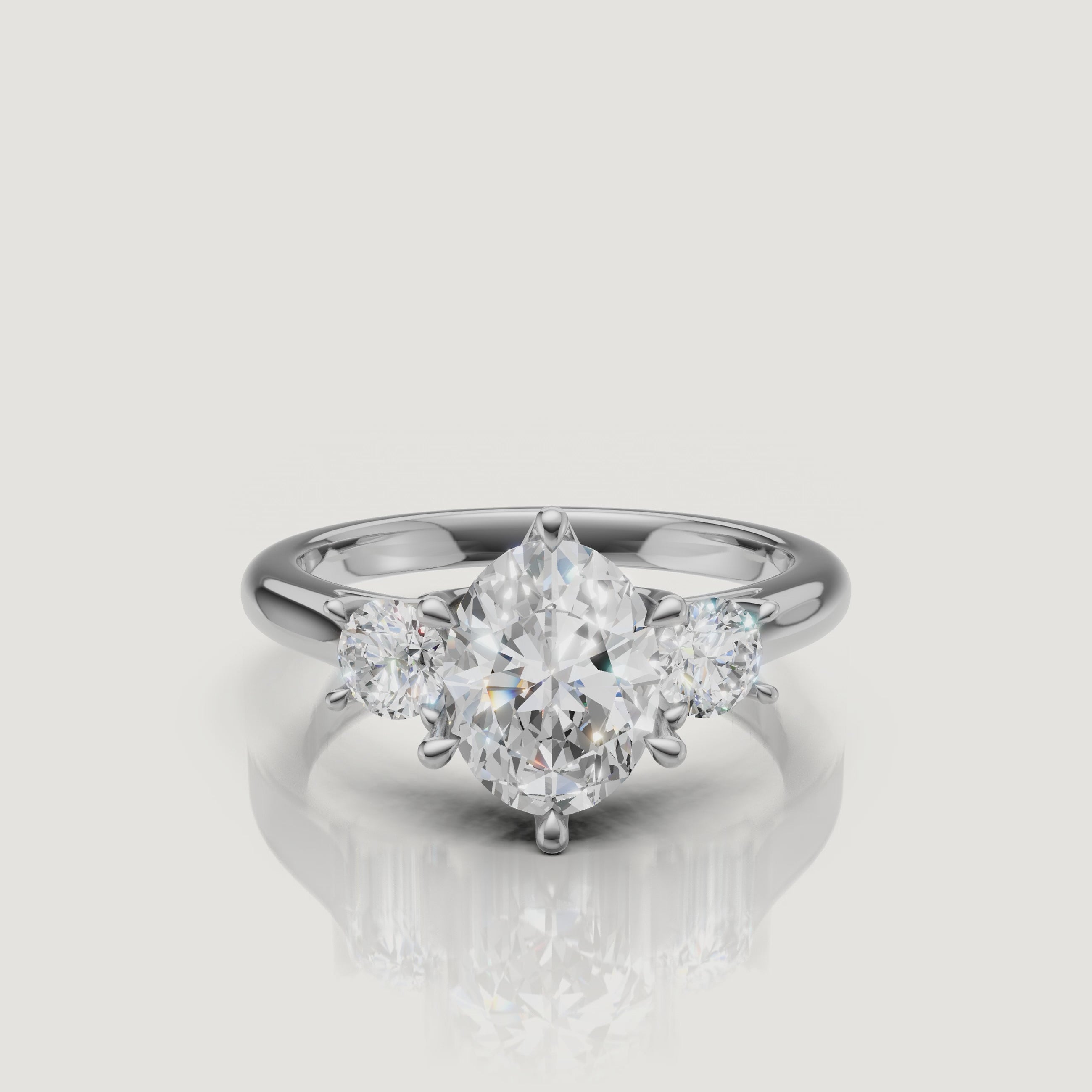 High-definition video of the Raul Diamonds white gold oval three-stone engagement ring, demonstrating the exceptional light performance and modern trilogy setting.