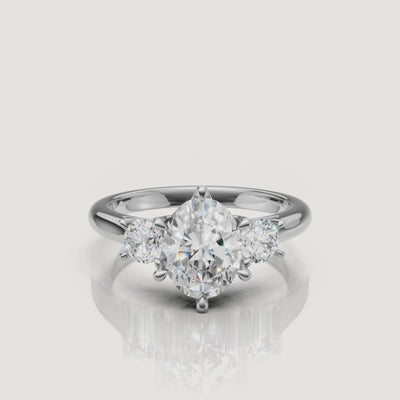 High-definition video of the Raul Diamonds white gold oval three-stone engagement ring, demonstrating the exceptional light performance and modern trilogy setting.
