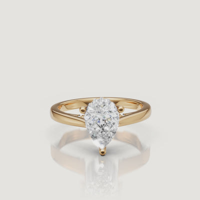 14K yellow gold pear-shaped lab-grown diamond engagement ring with hidden halo and pavé details by Raul Diamonds rotating video