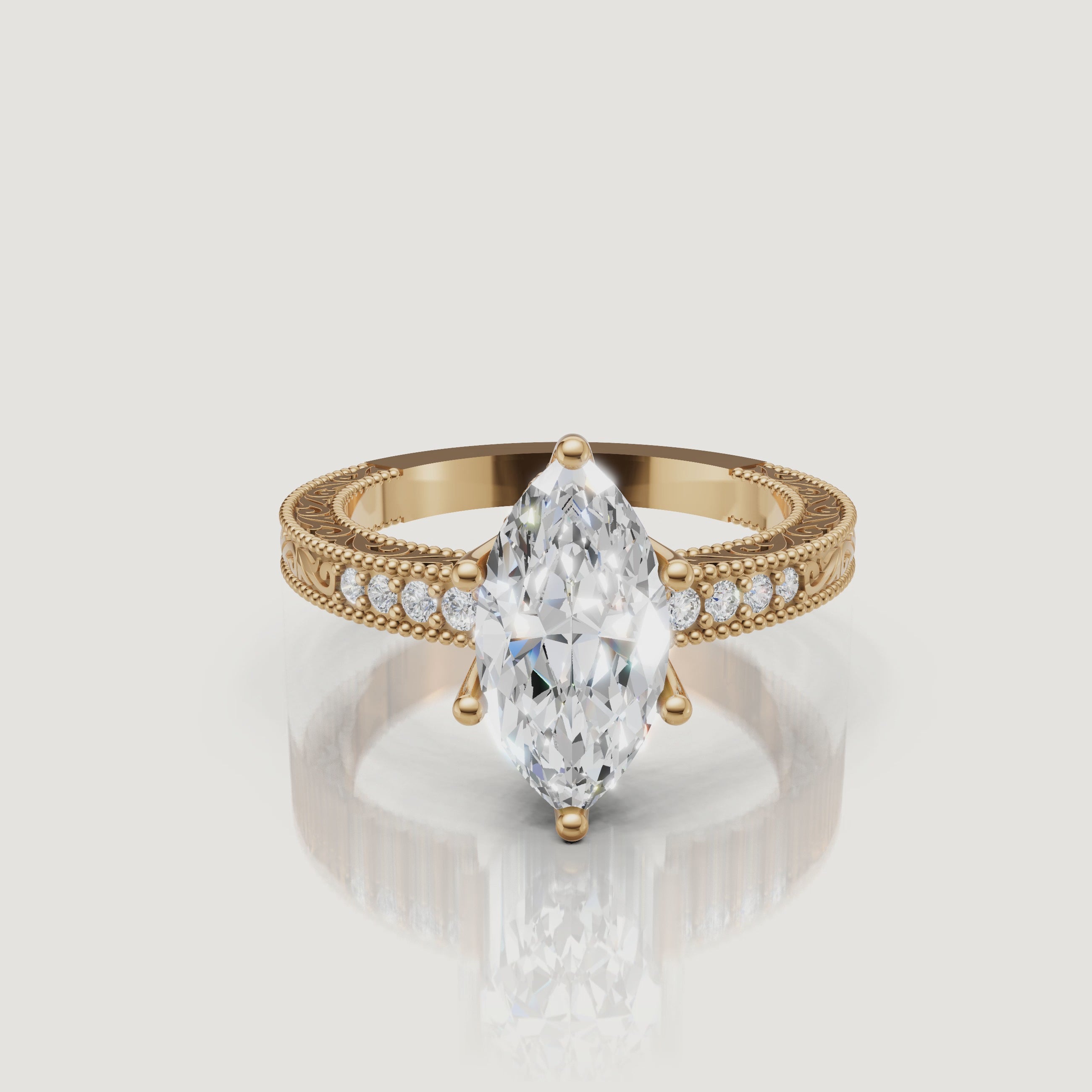 360 video of vintage marquise cut lab grown diamond engagement ring in 14K yellow gold with intricate filigree detailing by Raul Diamonds.