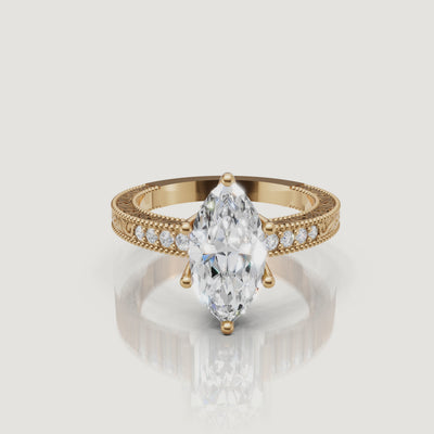 360 video of vintage marquise cut lab grown diamond engagement ring in 14K yellow gold with intricate filigree detailing by Raul Diamonds.