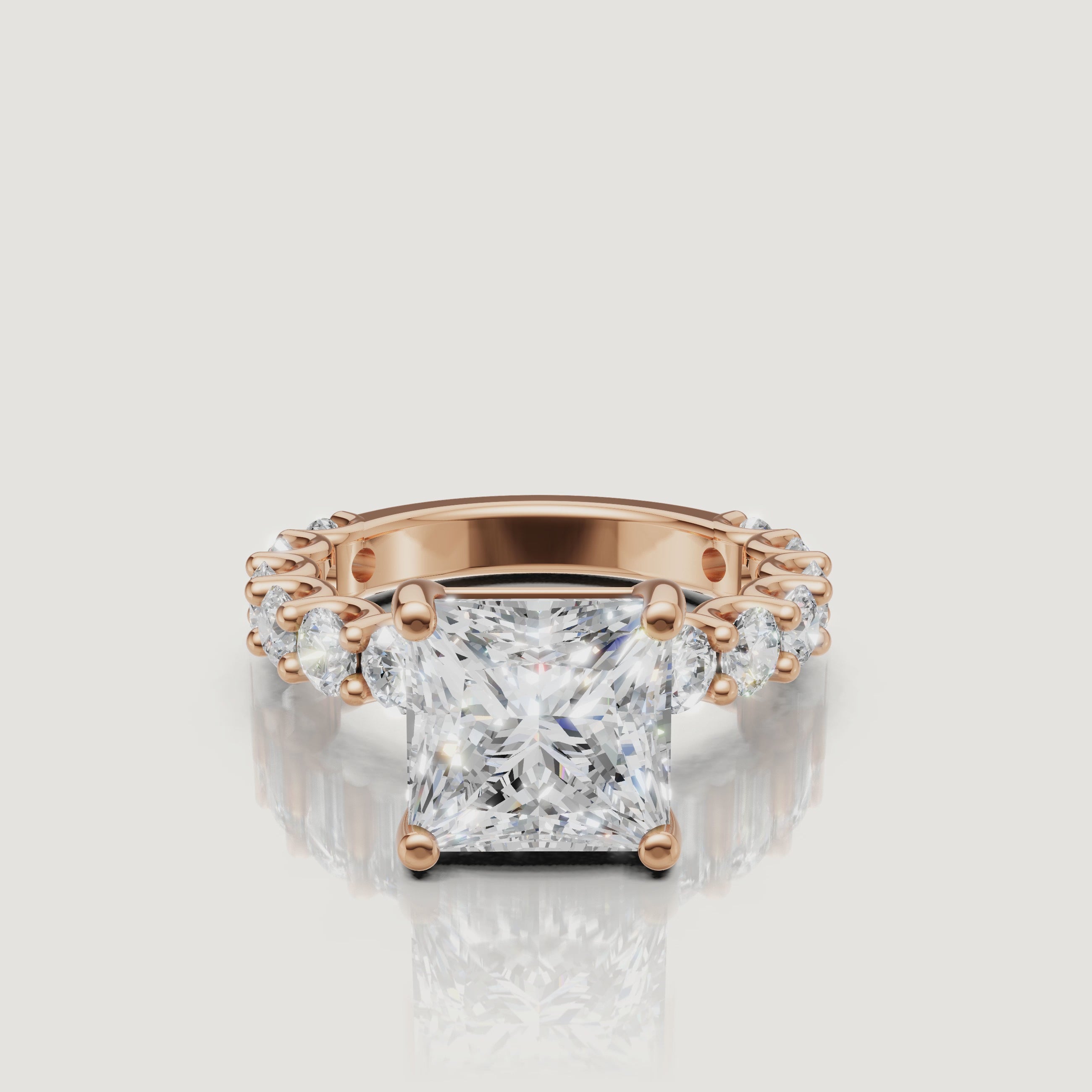 Cinematic rotation of a rose gold princess-cut diamond engagement ring by Raul Diamonds, highlighting the hidden halo and sparkling pave diamonds