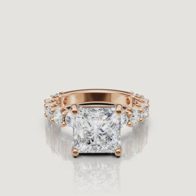 Cinematic rotation of a rose gold princess-cut diamond engagement ring by Raul Diamonds, highlighting the hidden halo and sparkling pave diamonds