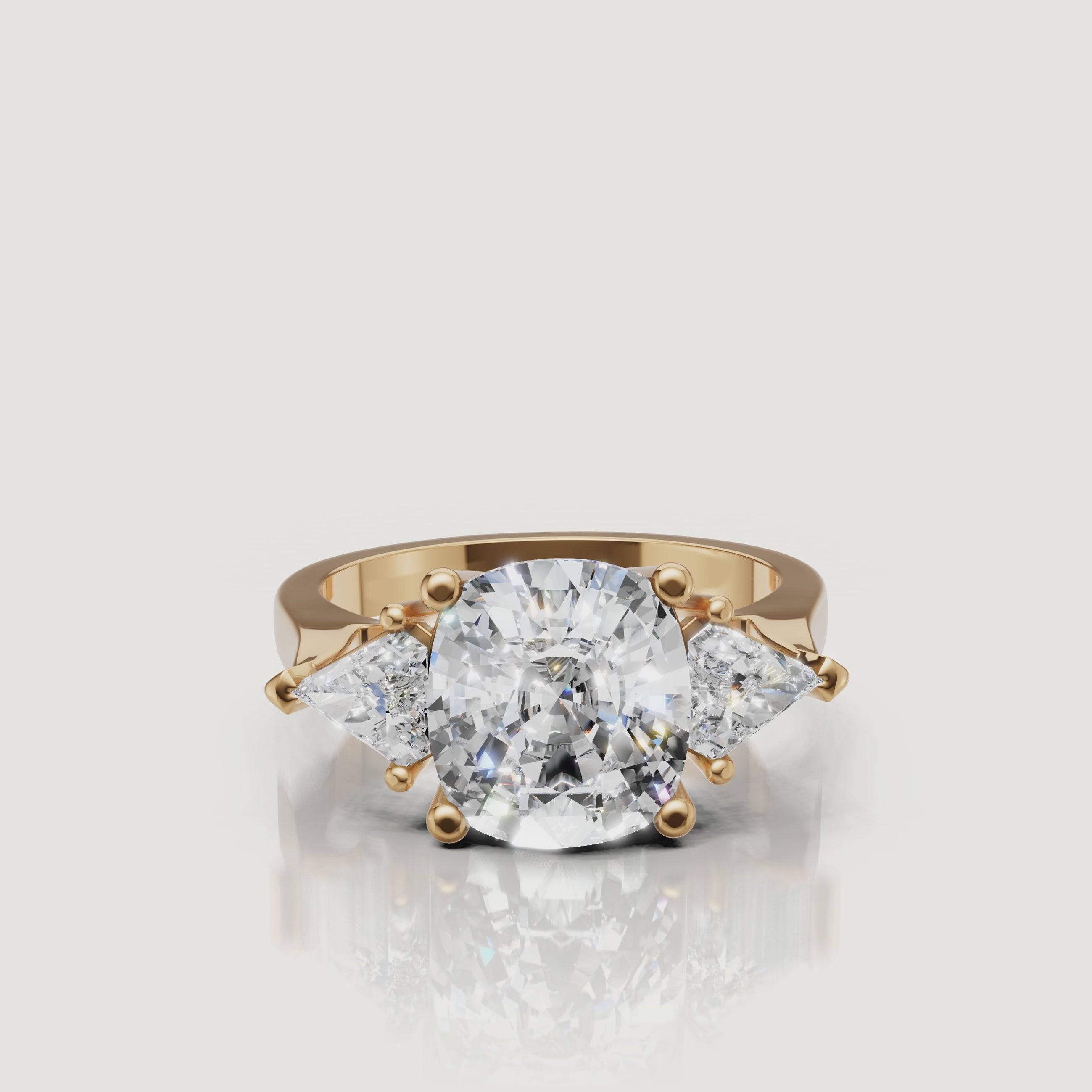 360 video of Raul Diamonds yellow gold round three stone diamond engagement ring with pear side diamonds