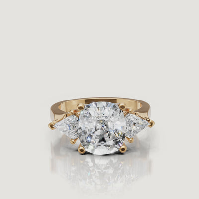 360 video of Raul Diamonds yellow gold round three stone diamond engagement ring with pear side diamonds