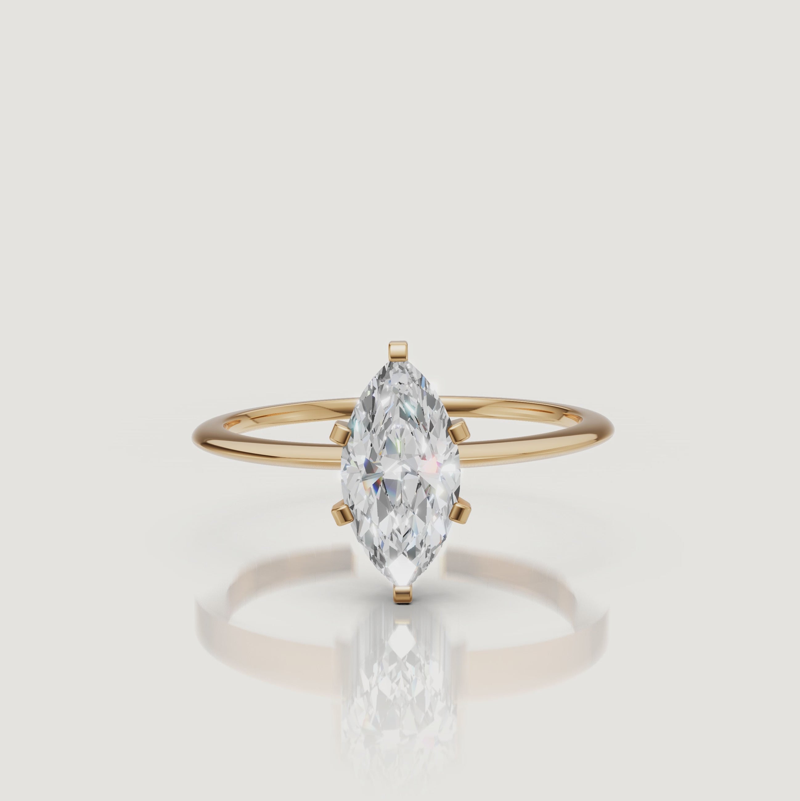 Cinematic video of a marquise cut lab grown diamond solitaire engagement ring in yellow gold by Raul Diamonds featuring elegant hand movement, macro diamond sparkle, warm luxury lighting, and premium bridal jewelry styling