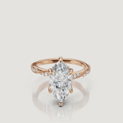 14K yellow gold marquise cut lab grown diamond engagement ring with twisted pavé band and elongated sparkle by Raul Diamonds
