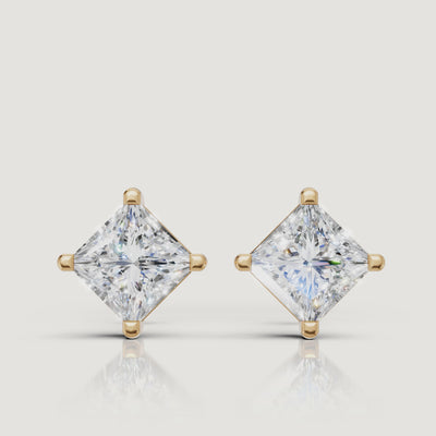 Yellow gold princess cut diamond stud earrings cinematic jewelry video by Raul Diamonds