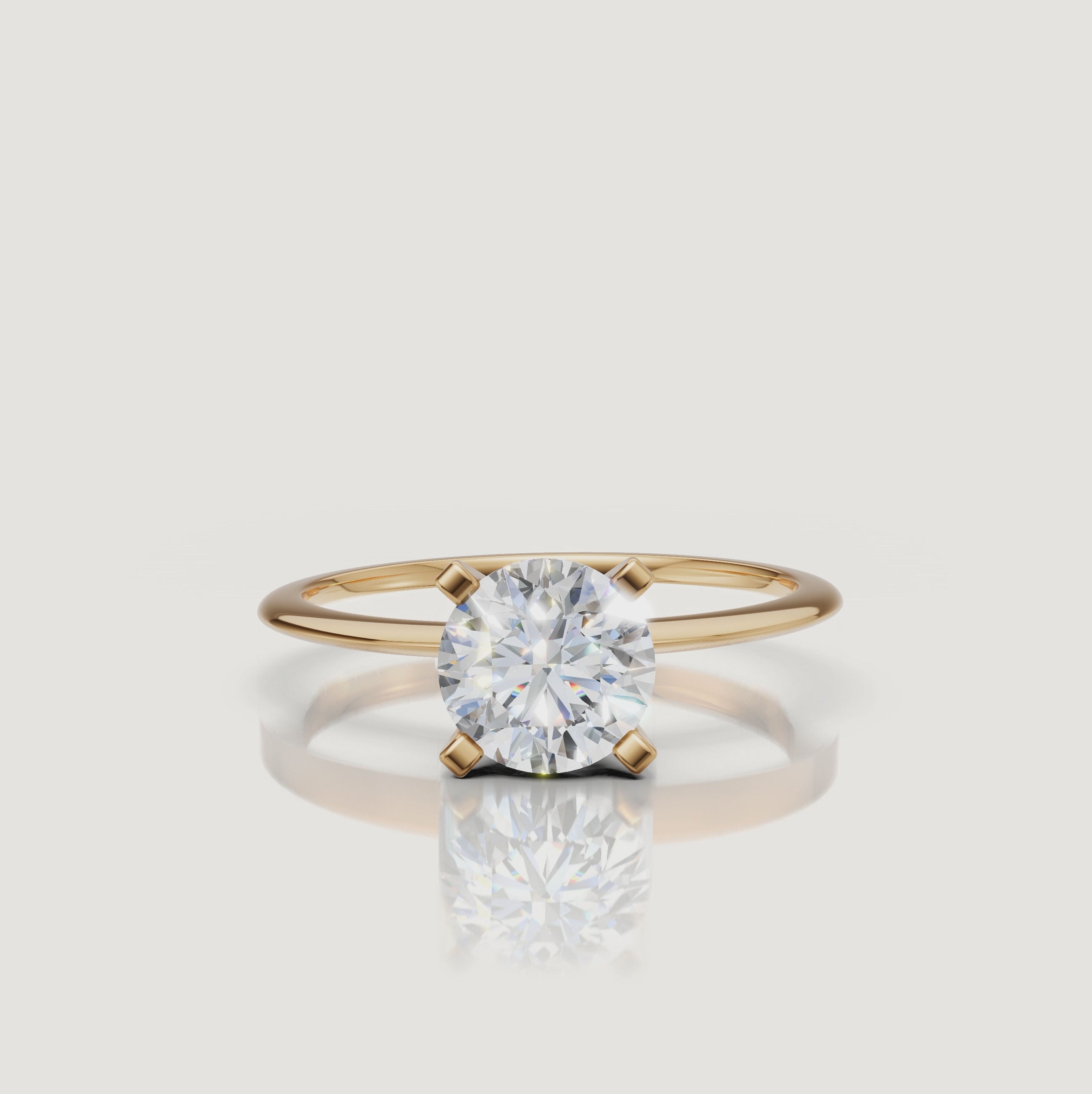 Cinematic video of a round brilliant lab grown diamond solitaire engagement ring in yellow gold by Raul Diamonds featuring macro diamond sparkle, elegant hand movement, warm luxury lighting, and premium bridal jewelry styling