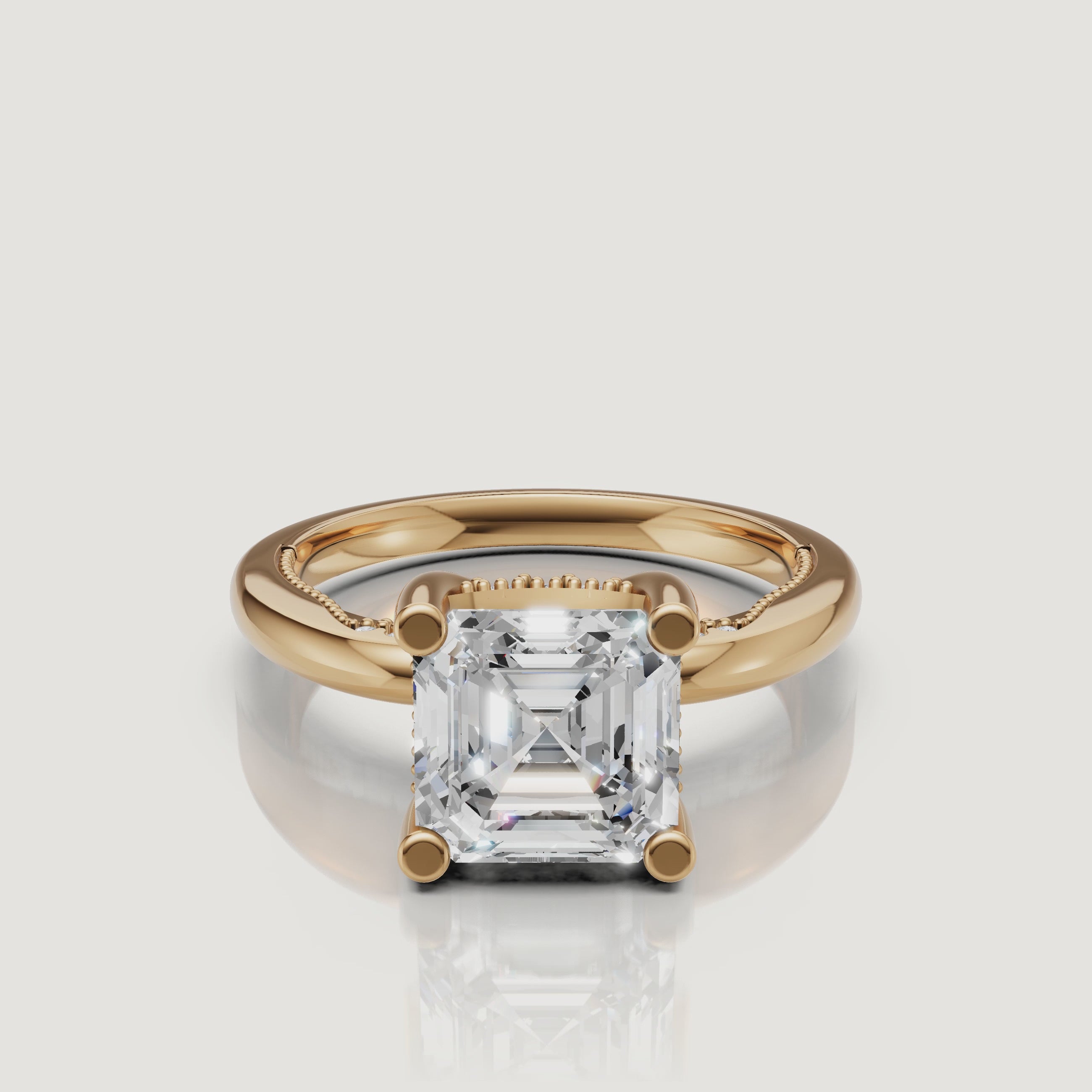 Cinematic 360-degree view of a Raul Diamonds Asscher cut ring in 18k yellow gold, highlighting the step-cut facets and warm metal glow