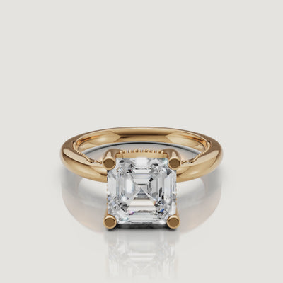 Cinematic 360-degree view of a Raul Diamonds Asscher cut ring in 18k yellow gold, highlighting the step-cut facets and warm metal glow
